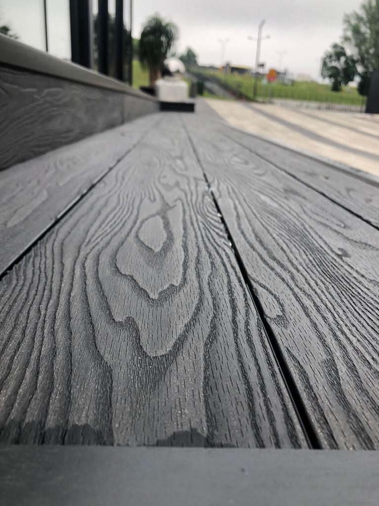 Dark shades of decking. Pros and cons. Bruggan presented the darkest new product - Anthracite - an incredibly deep shade of charcoal with an elegant pearlescent sheen.